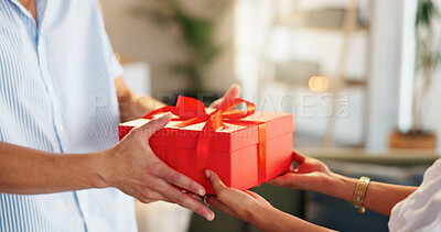 Buy stock photo Love, gift and giving with hands of couple for valentines day celebration, box or bonding. Relationship, care and romance with man and woman at home for support, connection or present together