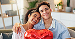 Couple, portrait or happy with heart balloon in home for valentines day gift, romantic holiday or bonding. People, smile or anniversary present on sofa for commitment, loyalty or love in relationship