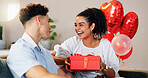 Love, gift and smile with couple on sofa for valentines day celebration, box or bonding. Relationship, balloons and romance with man and woman at home for support, connection or present together