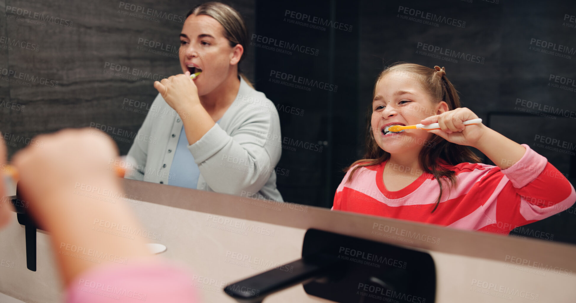 Buy stock photo Mother, girl and brushing teeth with smile in bathroom mirror, learning and dental wellness in home. Woman, child and toothbrush for cleaning mouth, health and teaching for oral care at family house