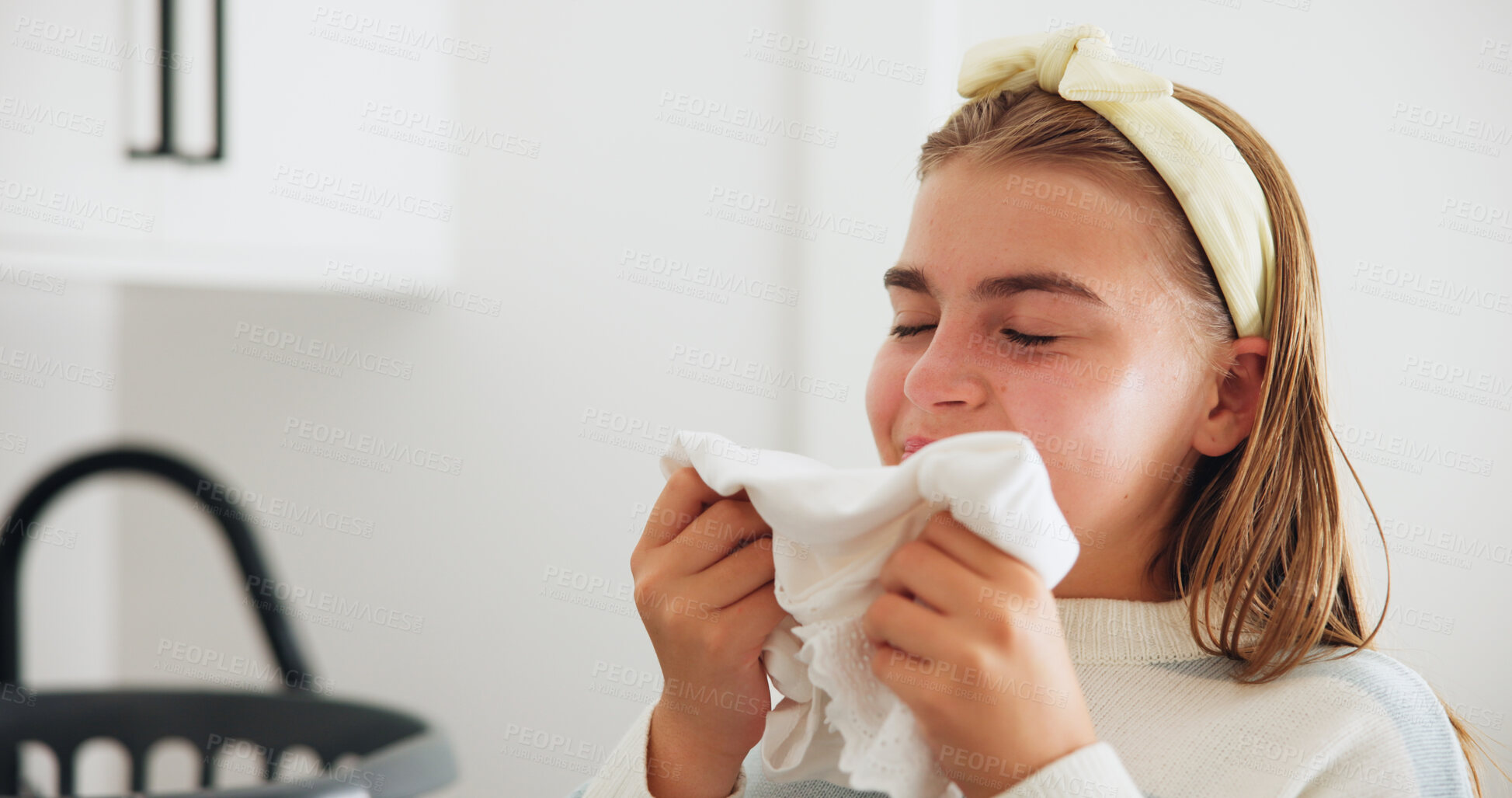 Buy stock photo Girl, fabric and smell with clean laundry for fresh scent, hygiene or disinfection at home. Female person, young teenager or aroma with garment or texture for softner, clothing or chores at house