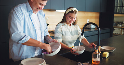 Buy stock photo Father, girl and washing dishes in home with bowl disinfection, helping and learning responsibility. Happy family, man and teenage daughter cleaning with support, bonding together and kitchen hygiene