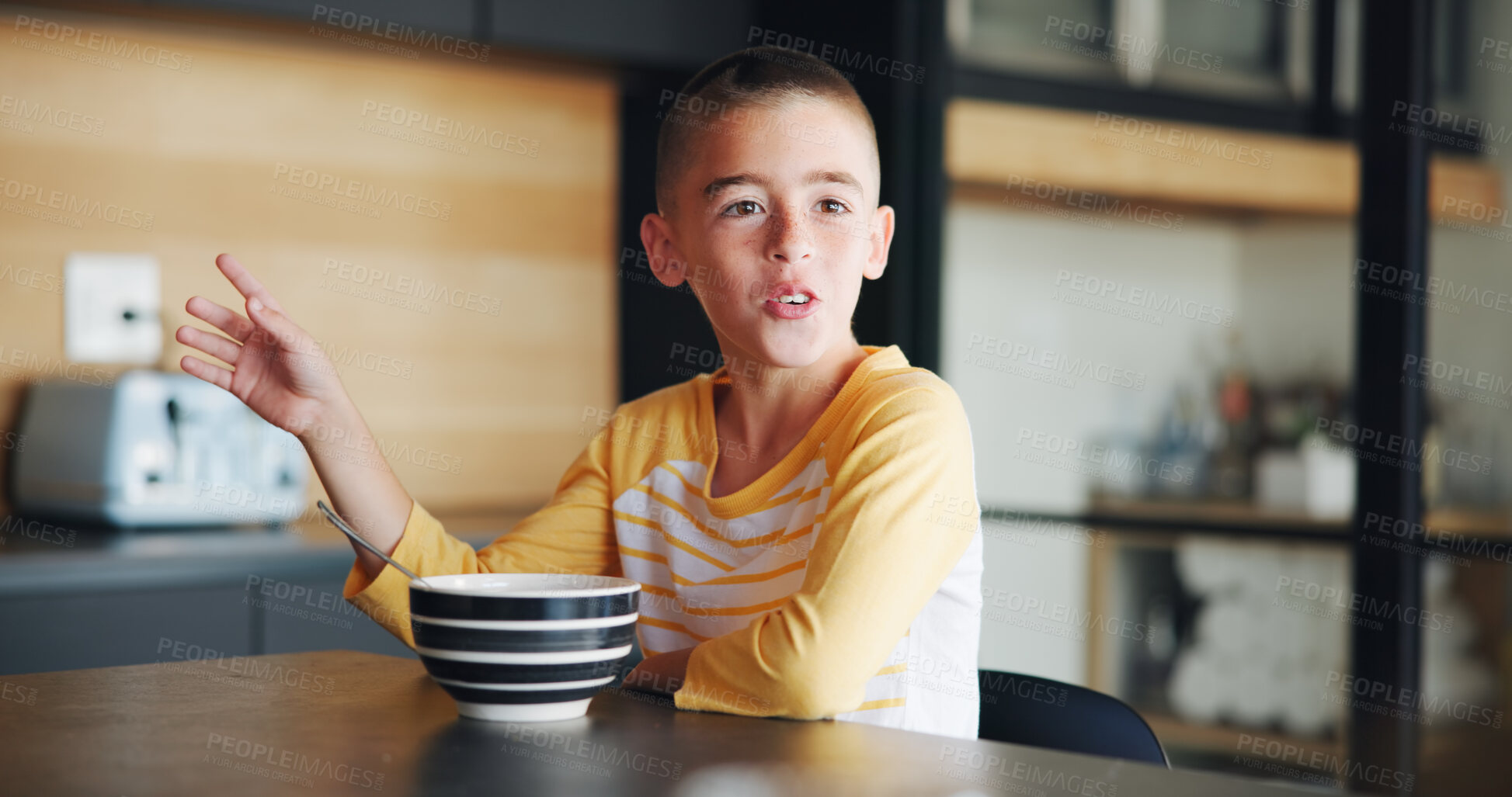 Buy stock photo Breakfast, child and cereal with talking in kitchen for healthy development, morning routine and explain story. Happy, boy kid and porridge in home for fiber meal, nutrition and conversation in house