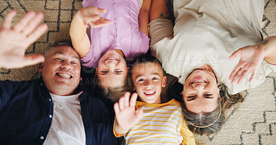 Buy stock photo Wave, portrait and above of parents with children for memory, profile picture and hello for social media. Family, home and mom, dad and kids on floor for bonding, love and relax in living room