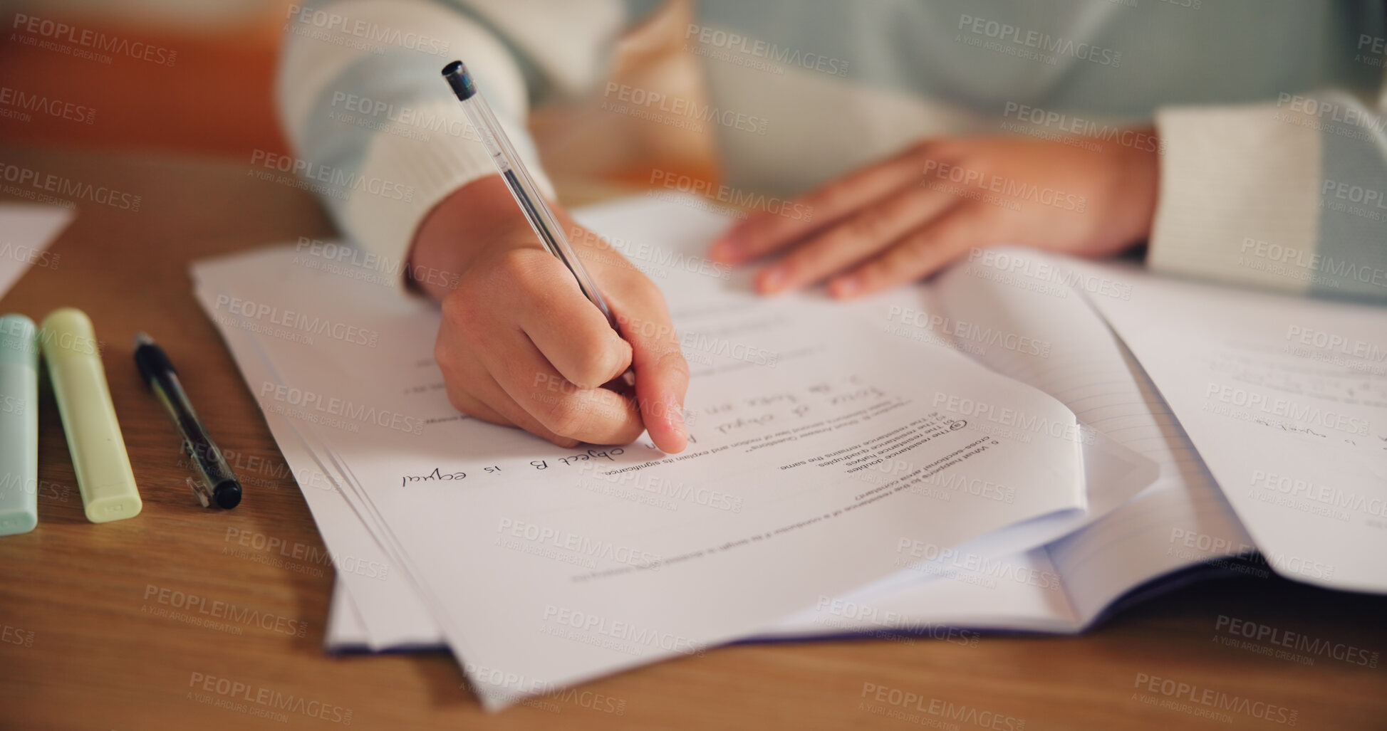 Buy stock photo Writing, homework and hands of child in classroom for learning, education and lesson. School, studying and closeup of young student with assessment, quiz and assignment for knowledge at academy