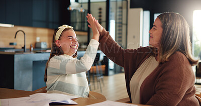 Buy stock photo Girl, high five and mom with education, happy or motivation for learning with success in kitchen. People, mother and daughter with cheers, celebration or smile with books for homework in family house