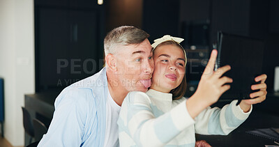 Buy stock photo Man, daughter and silly face with selfie for photography, picture or bonding together at home. Happy father, teenager or girl with smile, technology or tongue out for memory, humor or social media