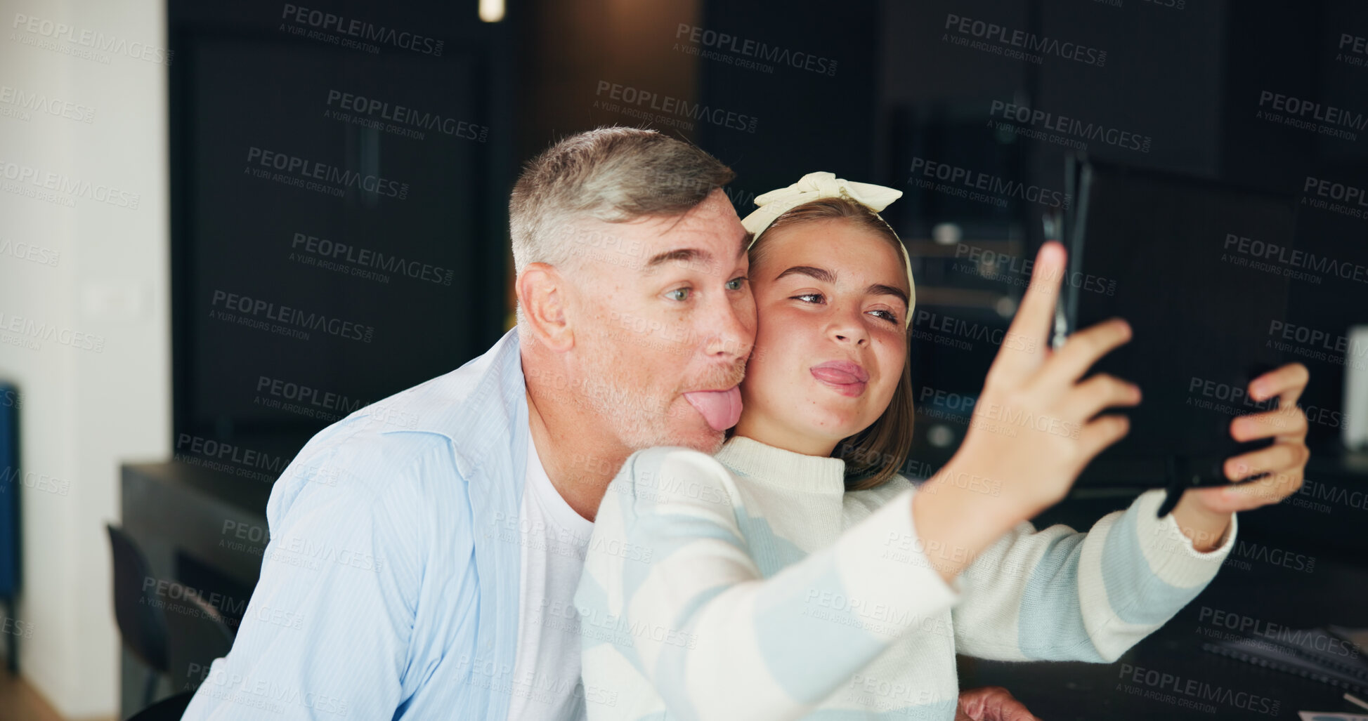 Buy stock photo Man, daughter and silly face with selfie for photography, picture or bonding together at home. Happy father, teenager or girl with smile, technology or tongue out for memory, humor or social media