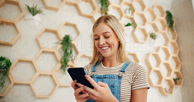 Buy stock photo Small business, smile and woman with smartphone, watching and streaming on social media, reviews and tech. Floral shop, entrepreneur and person with app for videos, sustainable and happy with ratings