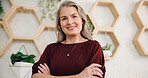 Happy woman, confident or mature manager in hotel lobby for accommodation, portrait or lodge. Face, hospitality or concierge with smile, pride or arms crossed for motel, resort or check in services