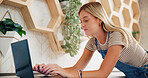 Woman, receptionist and typing with laptop for online booking, reservation or sending email at hotel. Female person, secretary or event planner with computer for schedule or checking dates at resort