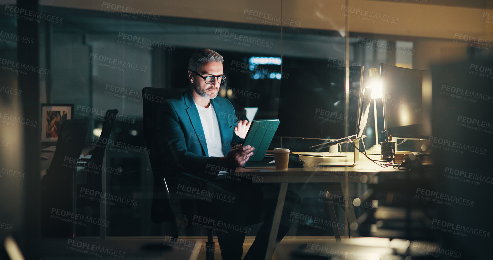 Buy stock photo Man, night and typing on tablet in office, financial consultant and online for trading trend. News, expert advisor and email international client for update on stock, deadline and mature person