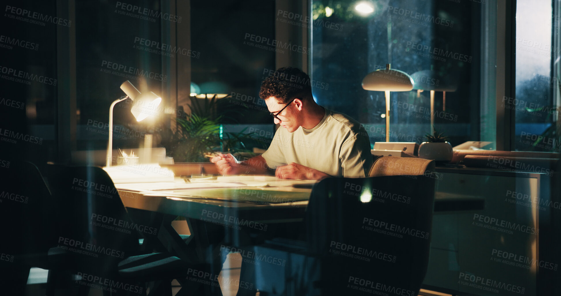 Buy stock photo Architecture, night and man in office with paperwork for urban planning, property design and floorplan. Creative agency, working late and person with layout, blueprint and documents for project