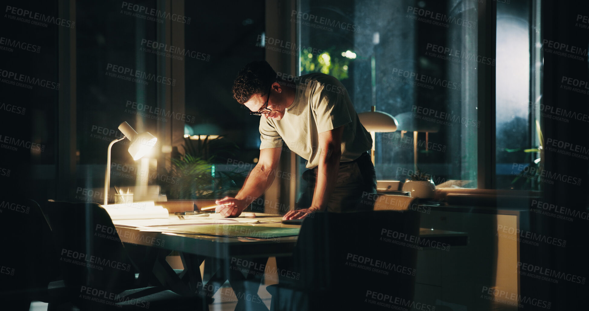 Buy stock photo Architecture, night and man in office drawing for urban planning, property design and floorplan. Creative agency, working late and architect with layout, blueprint and paperwork for building project