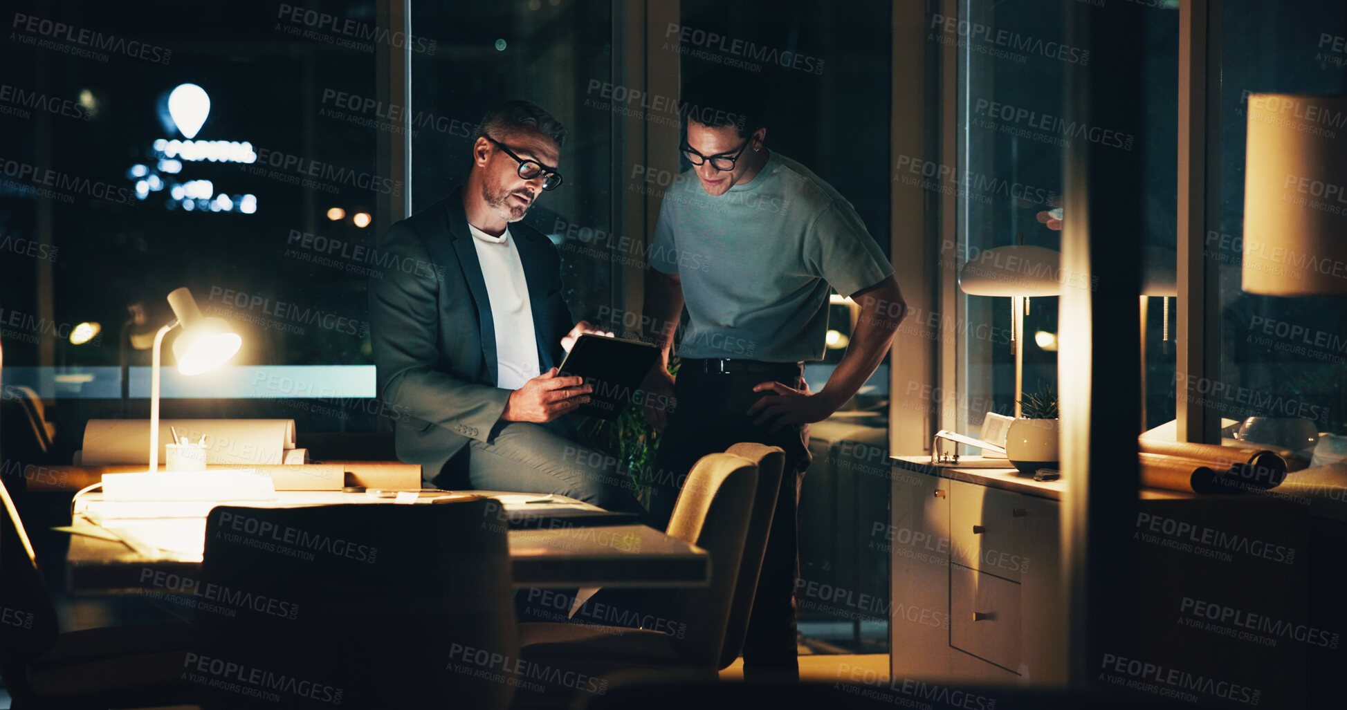 Buy stock photo Architecture, night and men in office for feedback, urban planning and property design or floorplan. Creative agency, working late and architect with layout, blueprint and ideas for building project