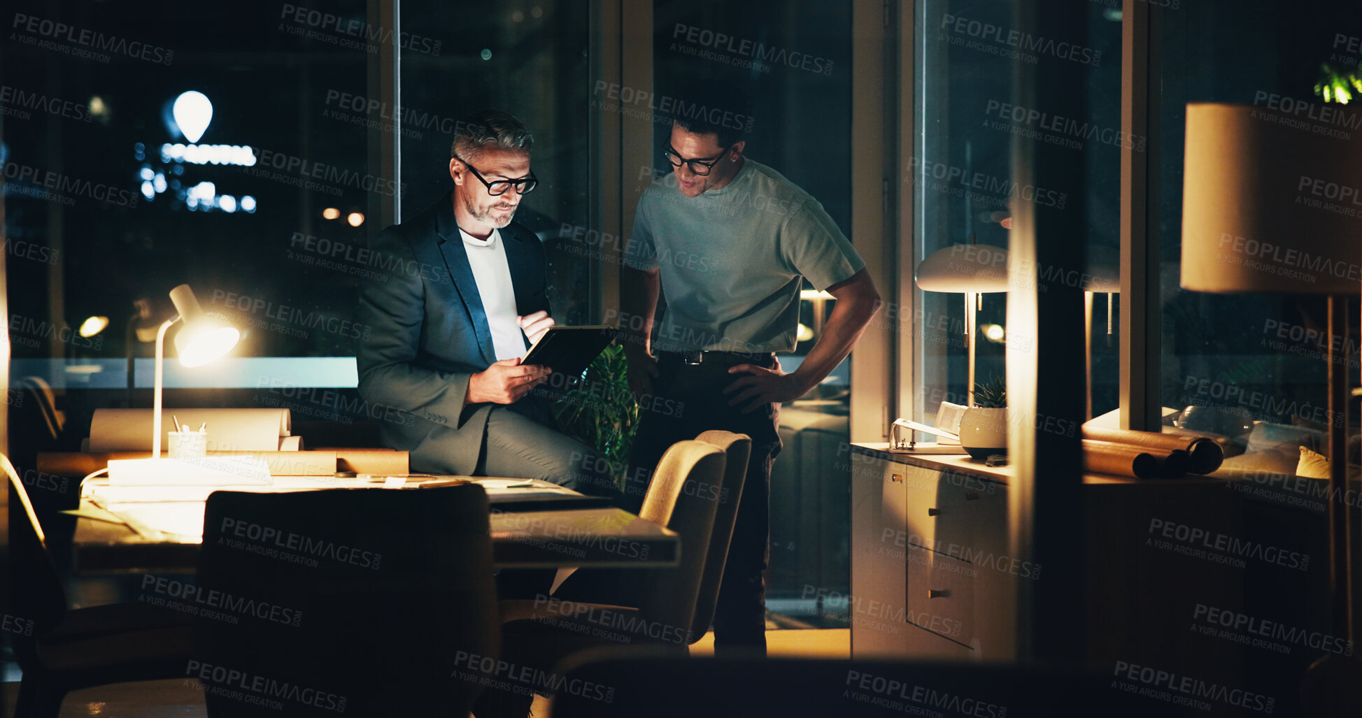 Buy stock photo Architecture, night and men in office for ideas, urban planning and property design or floorplan. Creative agency, working late and architect with layout, blueprint and feedback for building project