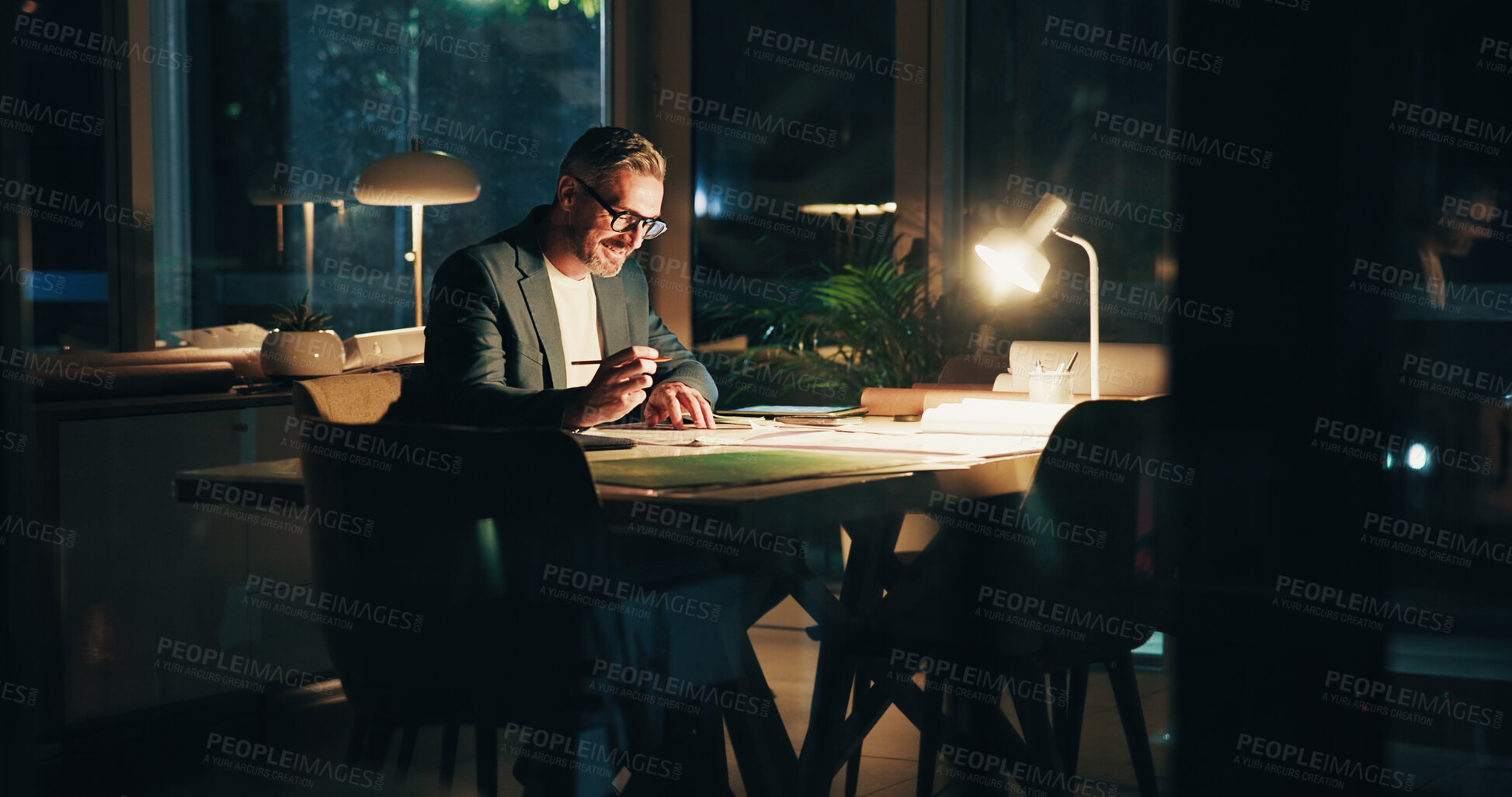 Buy stock photo Architecture, night and man in office with design for urban planning, property blueprint and floorplan. Creative agency, working late and person with layout, drawing or paperwork for building project
