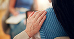 Person, hands and touch with empathy for social group, meeting or discussion at office. Closeup, shoulder and listening with therapist or clients for psychology, mental health or support at workshop