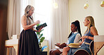 Women, therapist and coach with tablet or interns for presentation, therapy session or lesson at office. Female people, mentor and training with junior employees for psychiatry course or workshop