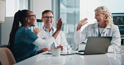 Buy stock photo Hospital, teamwork and doctors high five in meeting for consulting, discussion and medical success. Healthcare, excited and man and women on computer for collaboration, research or telehealth website