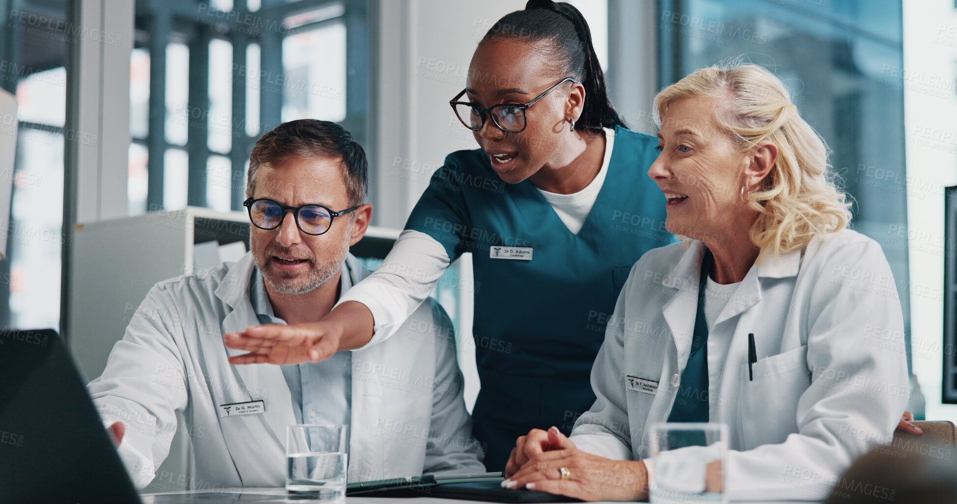 Buy stock photo Hospital, pointing and doctors on laptop in meeting for consulting, teamwork and medical advice. Healthcare, clinic and man with women on digital tech in collaboration, research or telehealth website
