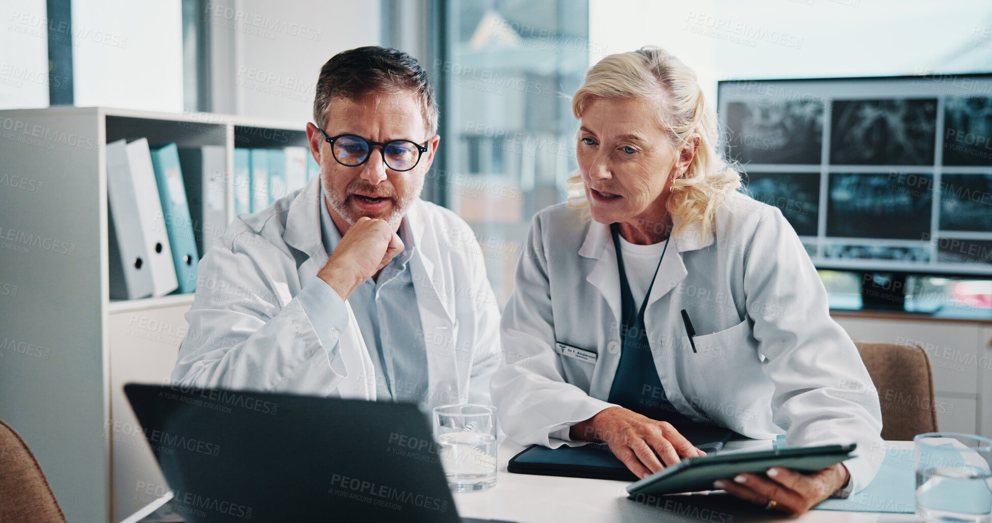 Buy stock photo People, doctors and meeting on laptop at hospital for x ray study, laboratory results and collaboration. Staff, tablet and online information for radiology, problem solving and medical report of scan