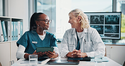 Buy stock photo Tablet, doctor and medical student in hospital with xray for surgery planning in collaboration. Women, discussion and mature surgeon with healthcare intern for teaching treatment with MRI scan.