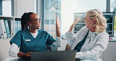 Buy stock photo High five, doctor and medical student in hospital with laptop for surgery planning in collaboration. Women, celebration and mature surgeon with healthcare intern for teaching treatment with computer.