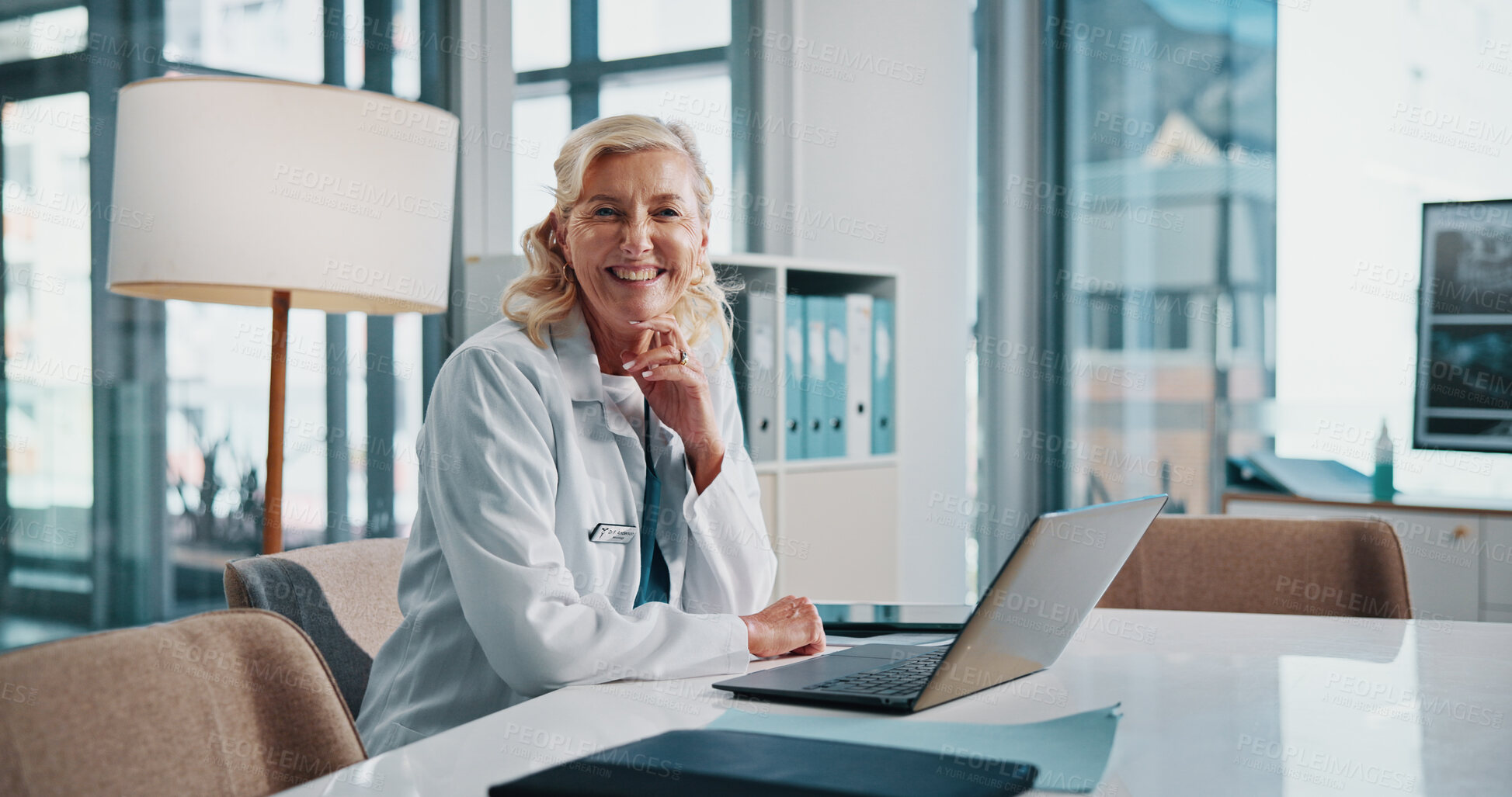 Buy stock photo Doctor, healthcare and laptop with portrait of woman in office of hospital for diagnosis, planning or research. Computer, medical and smile of mature medicine professional in clinic to update records