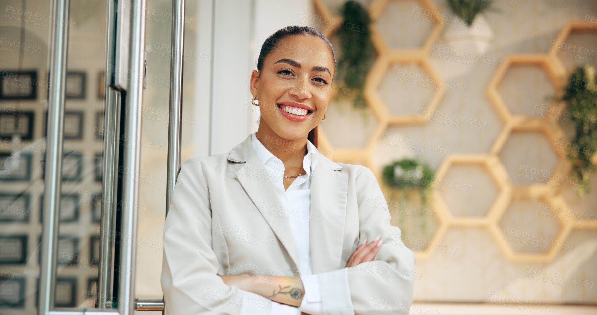 Buy stock photo Arms crossed, portrait and smile of woman concierge in hotel for accommodation or welcome. Booking, hospitality and reservation with friendly receptionist in lodge or resort for holiday or vacation