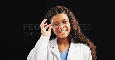 Buy stock photo Portrait, child and doctor with glasses in studio for future career, playful learning and medical costume. Smile, kid and eyewear for healthcare fantasy, education and opportunity on black background