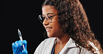 Child, play and doctor with syringe in studio of vaccine, drug injection and medicine treatment. Smile, kid and needle of healthcare safety, virus prevention or medical innovation on black background