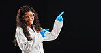 Happy girl, portrait and pointing with scientist in studio for advertising or marketing on a dark background. Female person, teenager or junior science with gesture for tips, list or sign up on space