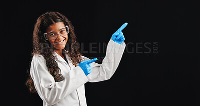 Buy stock photo Happy girl, portrait and pointing with scientist in studio for advertising or marketing on a dark background. Female person, teenager or junior science with gesture for tips, list or sign up on space