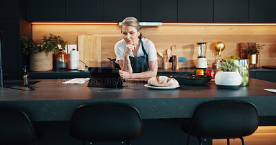 Buy stock photo Home, thinking and woman in kitchen, tablet or food with nutrition, social media or chef. Senior person, apartment or chef with tech, influencer or problem solving with research for baking technique 