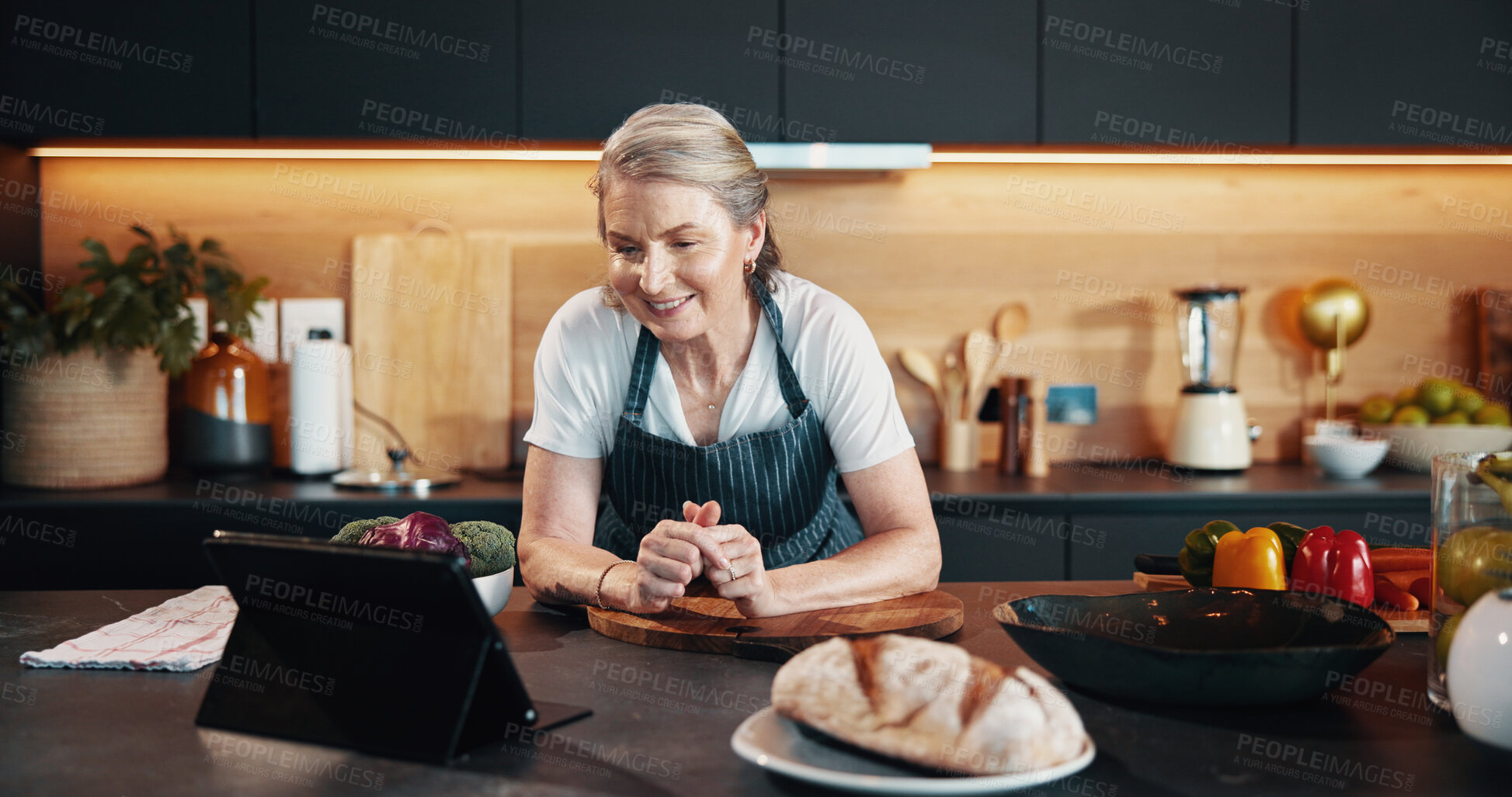 Buy stock photo Home, internet and woman in kitchen, tablet or food with nutrition, online reading or chef. Senior person, smile or lady with tech, connection or problem solving with research for baking technique