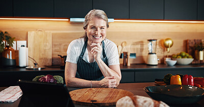 Buy stock photo Portrait, smile and woman in kitchen, tablet or food with nutrition, pride and confidence Senior person, house and lady with tech, internet and culinary skills with hobby, ingredients and recipe