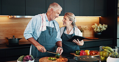 Buy stock photo Love, cooking and mature couple with vegetables, kitchen and bonding with ingredients for cuisine in home. Healthy food, helping or people with tablet for research, recipe or culinary skills in house