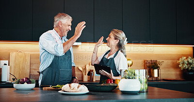 Buy stock photo Cooking, couple and high five for meal, kitchen and bonding with ingredients for cuisine in home. Healthy food, dinner and mature people with tablet for recipe, happy and celebration for success