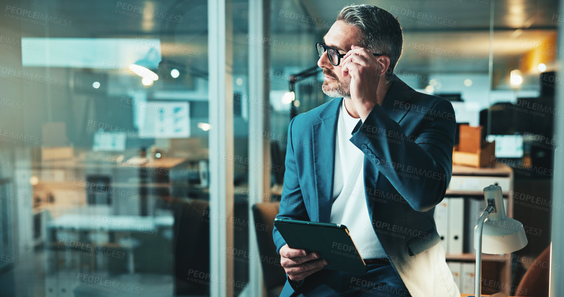 Buy stock photo Night, thinking and man on tablet for office report, post deadline or online update research. Mature person, engagement or content strategy for digital marketing trends or social media growth on tech