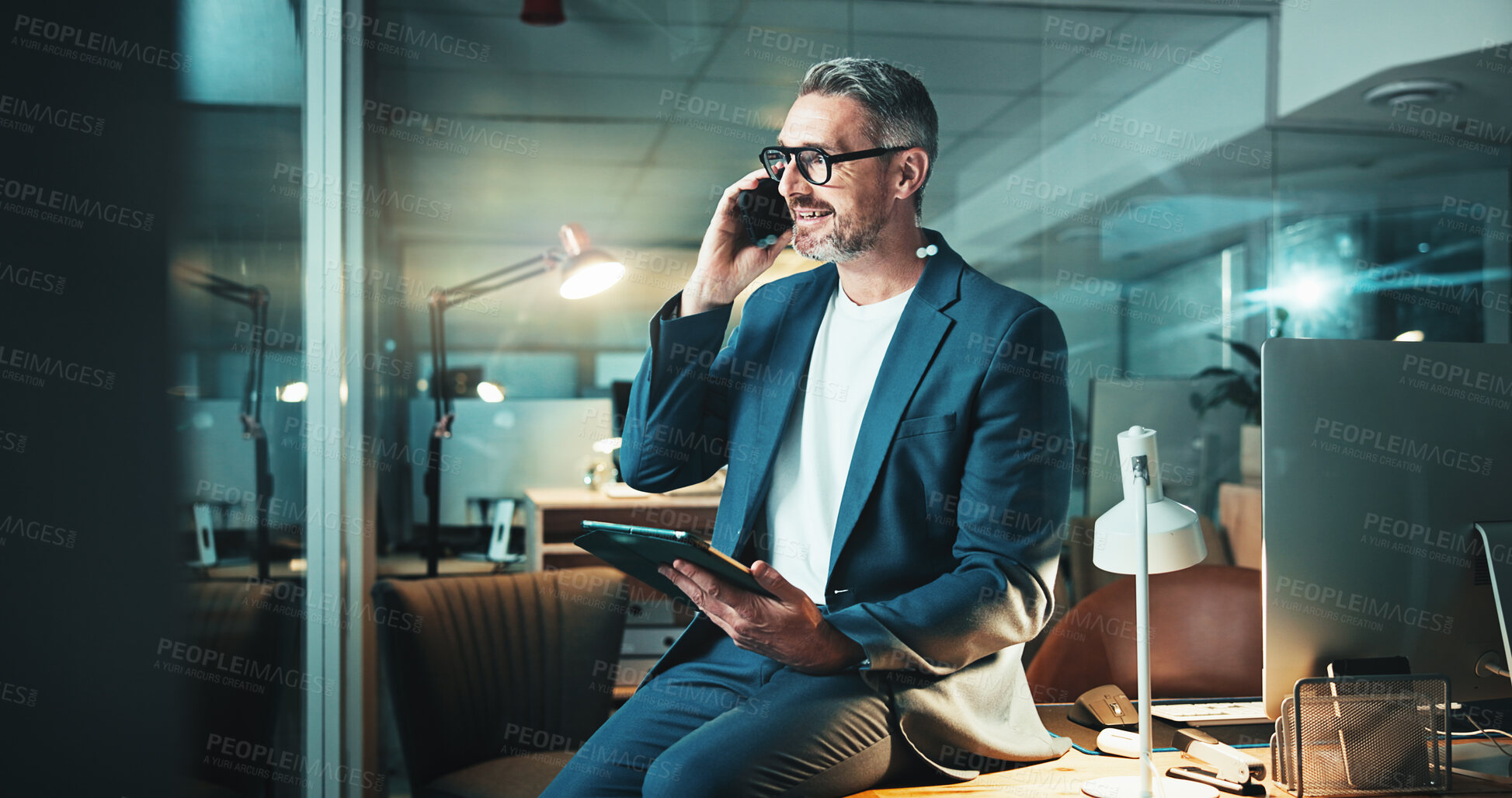 Buy stock photo Night, phone call and mature man with tablet, post deadline report or online update planning. Thinking, engagement or content strategy with tech for digital marketing agency or social media growth