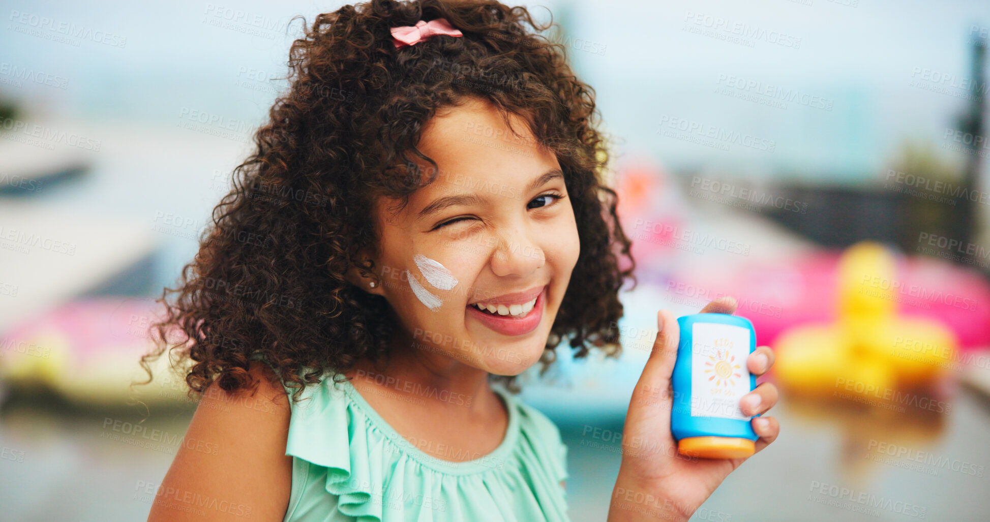 Buy stock photo Sunscreen, wink and portrait of girl at swimming pool for uv rays protection, spf cream and summer vacation. Sunblock lotion, dermatology product and smile with child at holiday resort for skincare