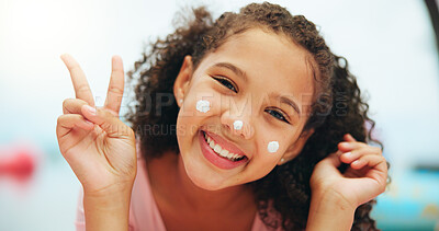 Buy stock photo Happy girl, portrait and peace sign with face cream for SPF, sunscreen or skincare at holiday resort. Female person, child or kid with smile, emoji or moisturizer for UV protection or summer vacation