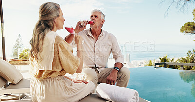 Buy stock photo Travel, drinking and mature couple with alcohol, relax and celebration of anniversary with liquor and outdoor. Bonding, man and woman with wine on resort, valentines day and people with commitment