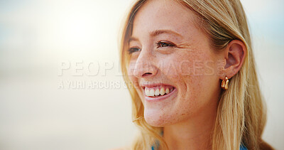 Buy stock photo Face, smile and freckles with woman on beach for travel, adventure and outdoor in morning. Mockup space, summer and wellness with happy female tourist with ocean, sea and vacation or holiday