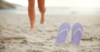 Buy stock photo Person, feet or slippers with beach sand for walk, summer fun or outdoor vacation in nature. Closeup, shoes or sandals with tourist on sandy shore for holiday, tropical getaway or catching sun at sea