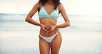 Woman, beach and love hands on stomach for holistic gut health, weightloss results and body balance. Space, person and bikini by ocean with heart emoji for self care, tummy confidence or healthy diet