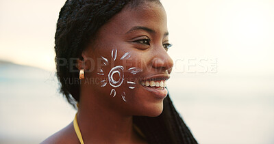 Buy stock photo Beach, face and black woman with sunscreen for skincare, uv protection or beauty at sunset. Ocean, sun cream drawing and spf cosmetics for dermatology, adventure or travel to relax on holiday