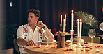 Man, thinking and waiting for date, romance and late for dinner in restaurant and valentines day. Night, worried and person with reservation for anniversary, fine dining and decor for celebration