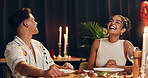 Couple, laughing and red wine on date at restaurant on valentines day, romantic dinner and celebration. People, alcohol glass and cuisine meal for fine dining, anniversary and relationship commitment